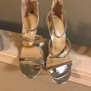 Forever 21 size7 silver strappyshoes gently worn. Heel is 4”